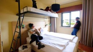 Cama ou camas em um quarto em WOT Sintra Ocean