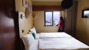 Cama ou camas em um quarto em WOT Sintra Ocean