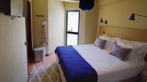 Cama ou camas em um quarto em WOT Sintra Ocean