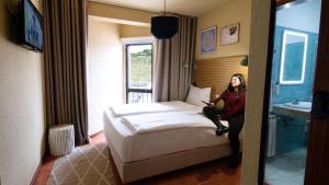 Cama ou camas em um quarto em WOT Sintra Ocean