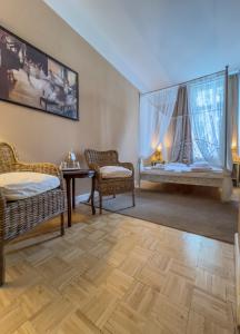 Postel nebo postele na pokoji v ubytování Hotel-Maison Am Olivaer Platz