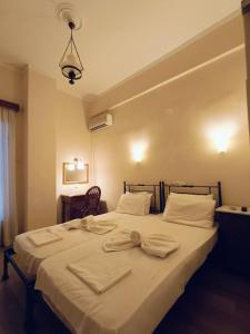 Postel nebo postele na pokoji v ubytování Anesis Hotel