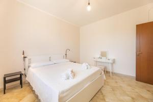 Postel nebo postele na pokoji v ubytování Villa Dolcevivere