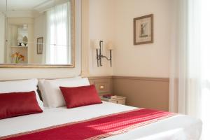 Postel nebo postele na pokoji v ubytování Hotel Villa Glori