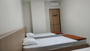 Postel nebo postele na pokoji v ubytování Ngaso Ing Salatiga