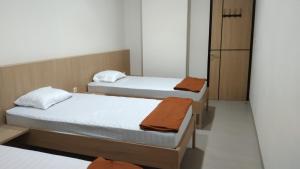 Postel nebo postele na pokoji v ubytování Ngaso Ing Salatiga