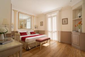 Postel nebo postele na pokoji v ubytování Hotel Villa Glori