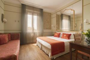 Postel nebo postele na pokoji v ubytování Hotel Degli Aranci + 37 fotografií