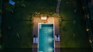 an overhead view of a pool in a garden at night at Private Pool Villa by the Sea in Kalamata