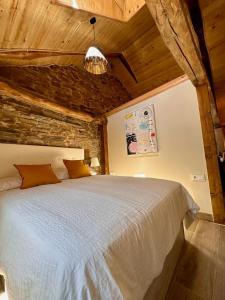a bedroom with a large bed in a room at CASA BORAL- Comfort exclusivo en plena naturaleza - Valle del Silencio in Manzanedo de Valdueza +15 photos