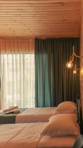 Postel nebo postele na pokoji v ubytování Garden rooms in Kutaisi