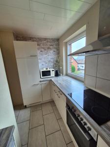 Kuchyň nebo kuchyňský kout v ubytování Ferienwohnung Hansemann OG + 2 fotografie