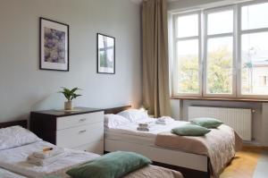 Posteľ alebo postele v izbe v ubytovaní Unique apartments Krasinskiego street