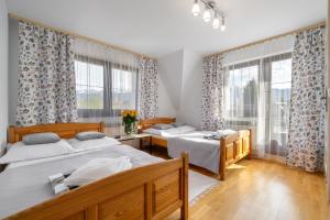Posteľ alebo postele v izbe v ubytovaní Apartament u Kostka