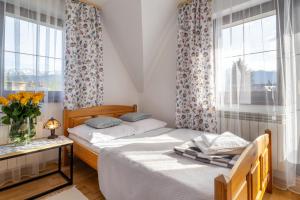Posteľ alebo postele v izbe v ubytovaní Apartament u Kostka
