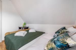 Posteľ alebo postele v izbe v ubytovaní Apartament u Kostka