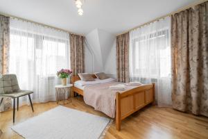 Posteľ alebo postele v izbe v ubytovaní Apartament u Kostka