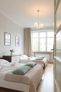 Posteľ alebo postele v izbe v ubytovaní Unique apartments Krasinskiego street