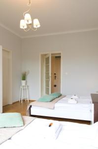Posteľ alebo postele v izbe v ubytovaní Unique apartments Krasinskiego street