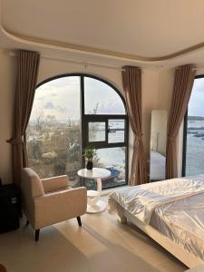 Ένα ή περισσότερα κρεβάτια σε δωμάτιο στο Moon Villa - Đảo Phú Quý