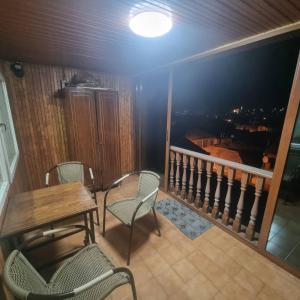 a balcony with a table and chairs on a balcony at veranda in Vanadzor +11 photos