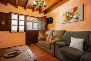 a living room with a couch and a table at Comeya in Cangas de Onís