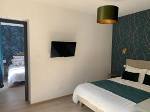 Postel nebo postele na pokoji v ubytování L'Elégant