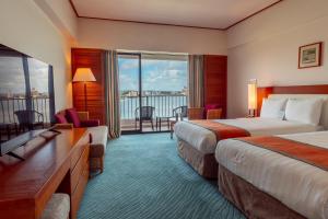 Postel nebo postele na pokoji v ubytování Hotel Nikko Guam