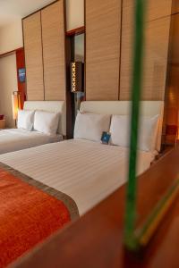 Postel nebo postele na pokoji v ubytování Hotel Nikko Guam
