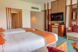 Postel nebo postele na pokoji v ubytování Hotel Nikko Guam