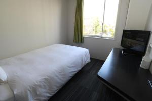 Postel nebo postele na pokoji v ubytování Washington R&BHotel TokyoToyocho