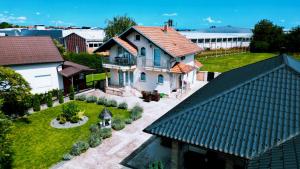 an aerial view of a house with a yard at Villa Zlatan Poolside in Bosanska Gradiška