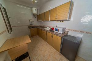 Kuchyň nebo kuchyňský kout v ubytování Zaki Hotel Apartment