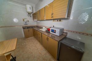Kuchyň nebo kuchyňský kout v ubytování Zaki Hotel Apartment
