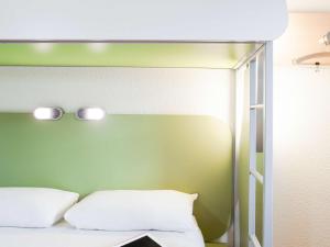 Postel nebo postele na pokoji v ubytování ibis budget Beaconsfield