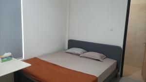 Postel nebo postele na pokoji v ubytování Ngaso Ing Salatiga