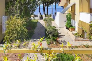 A garden outside Helios Villa Sea Front - 3 bedrooms 7 guests
