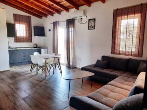 a living room with a couch and a table at Apartments Alavana in Velipojë