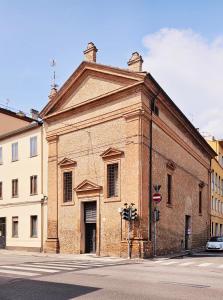 an old brick building on the corner of a street at Dimora Santa Barbara in Ferrara