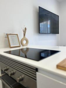 Kjøkken eller kjøkkenkrok på Playa Chica Luxury Apartament