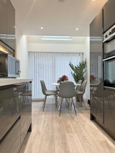 a kitchen and dining room with a table and chairs at Eagles Cottage, 3 - Bed, Sleeps 6, Pets Welcome - Ulverston in Ulverston