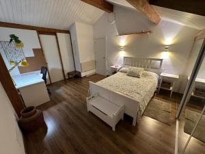 a small bedroom with a bed and a desk at Los Caserios in Torrelavega