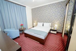 Voodi või voodid majutusasutuse Welcome Inn Hotel toas