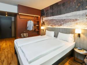Postel nebo postele na pokoji v ubytování Ibis Styles Singen
