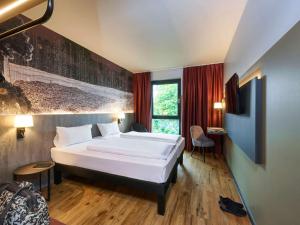 Postel nebo postele na pokoji v ubytování Ibis Styles Singen