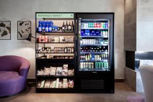 a refrigerator filled with lots of drinks in a store at Botanique Hotel Prague in Prague