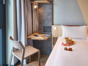 Postel nebo postele na pokoji v ubytování Ibis Budget Singen