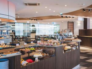 a buffet line with many different types of food at DoubleTree by Hilton Malta in St Paul's Bay