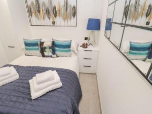 Ένα ή περισσότερα κρεβάτια σε δωμάτιο στο 2A Salubrious Terrace