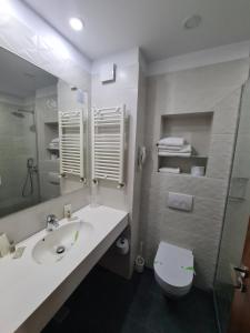 Koupelna v ubytování Hotel Comandor